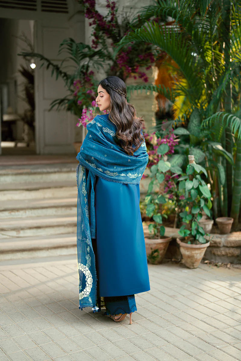 Model wearing deep teal blue Qalamkar SB-11 Noray embroidered outfit, perfect for Eid and Pakistani luxury pret clothes online in UK.