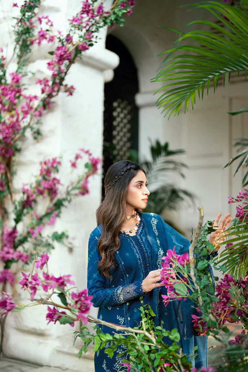 Model wearing deep teal blue Qalamkar SB-11 Noray embroidered outfit, perfect for Eid and Pakistani luxury pret clothes online in UK.