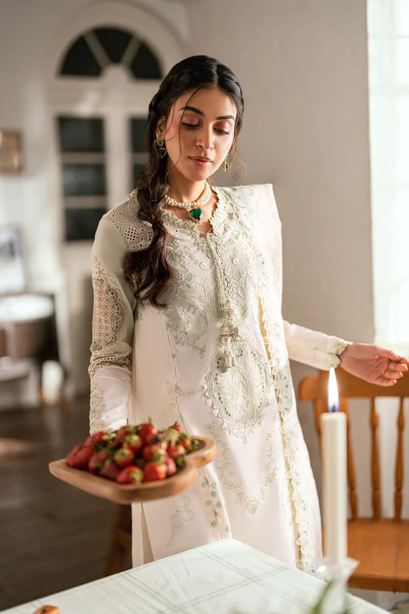 Model wearing pistachio green Qalamkar SB-10 Nadia embroidered outfit, perfect for Eid and Pakistani luxury pret clothes online in UK.