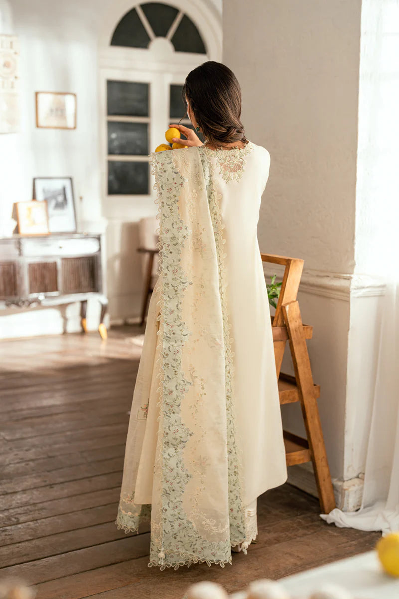 Model wearing pistachio green Qalamkar SB-10 Nadia embroidered outfit, perfect for Eid and Pakistani luxury pret clothes online in UK.