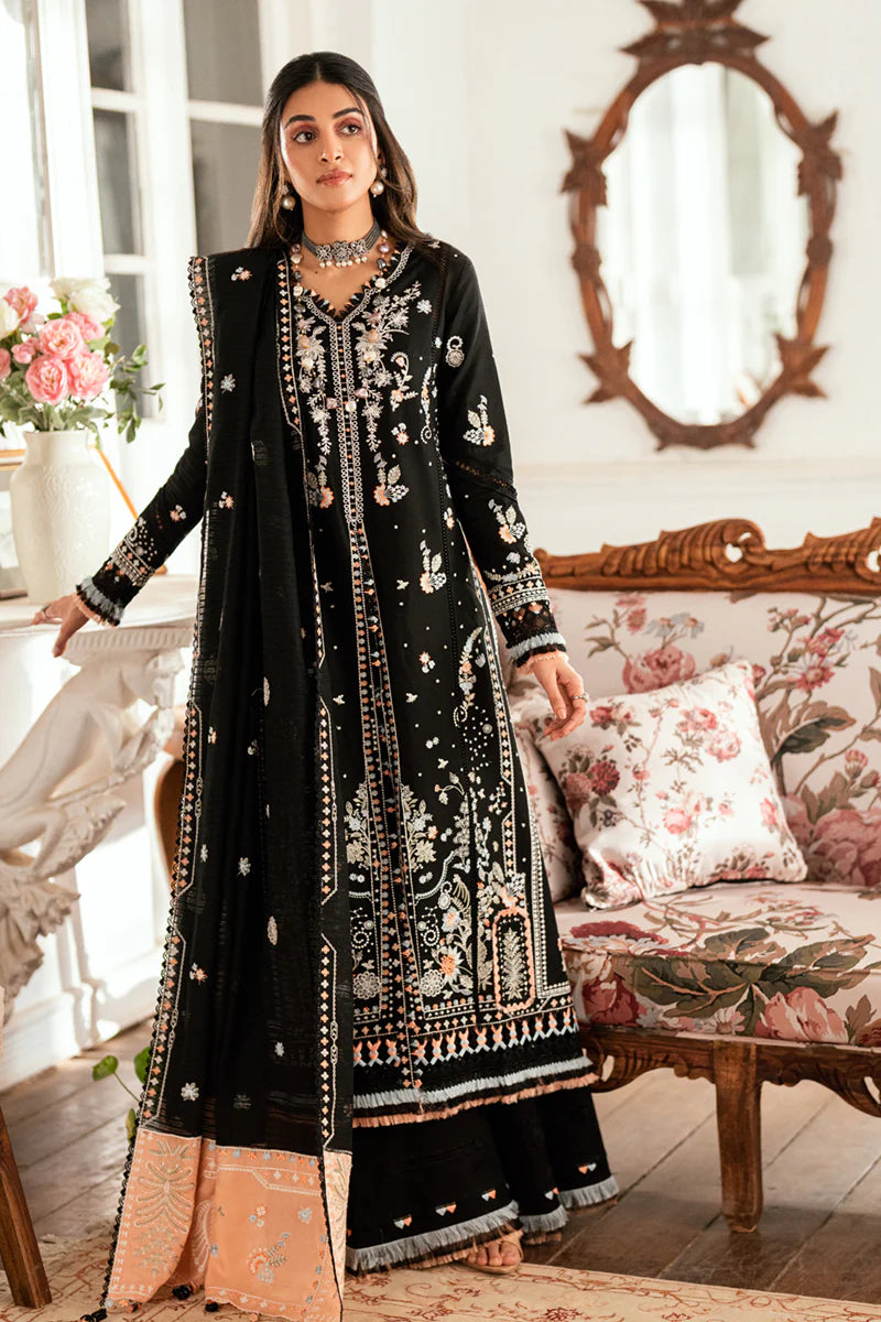 Model wearing black Qalamkar SB-03 Misha embroidered suit with peach accents, ideal for Eid and Pakistani luxury pret online in UK.