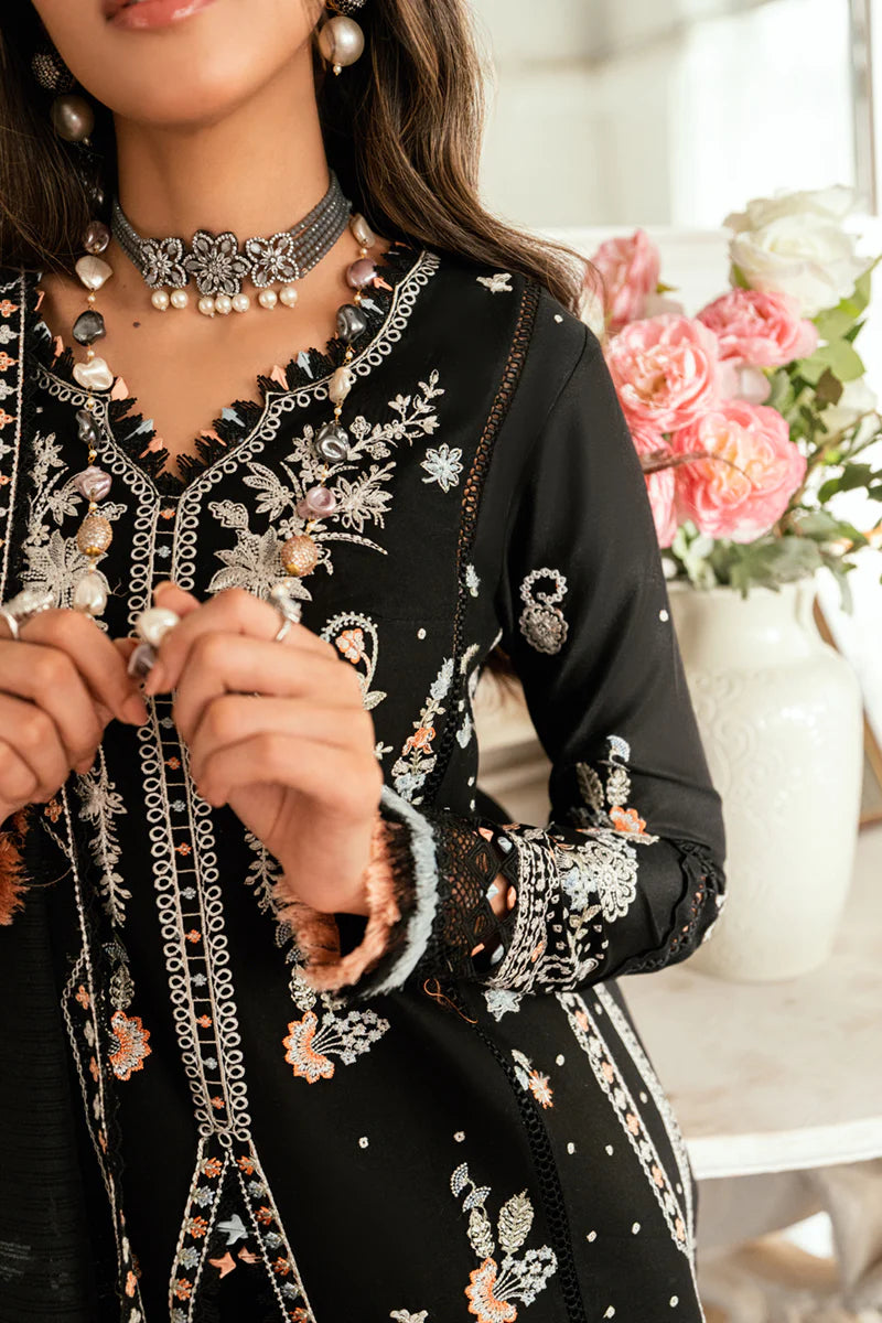 Model wearing black Qalamkar SB-03 Misha embroidered suit with peach accents, ideal for Eid and Pakistani luxury pret online in UK.
