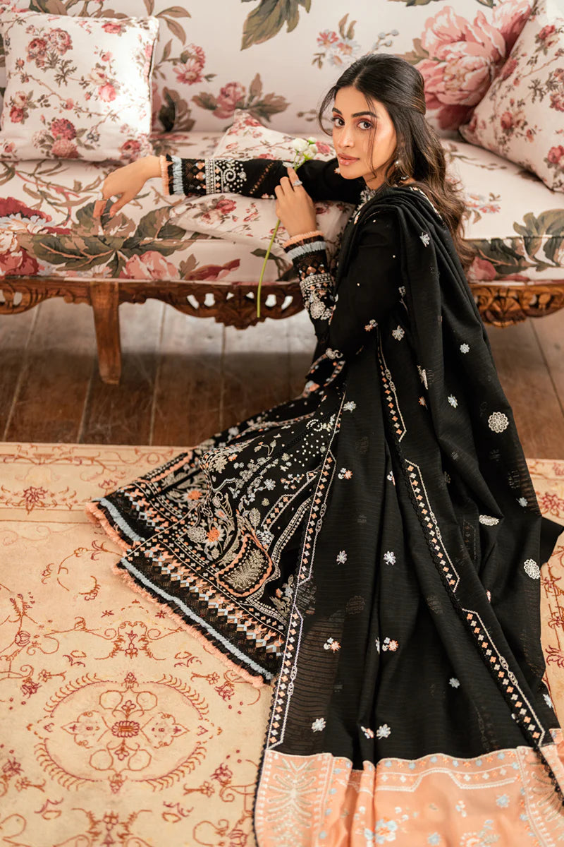 Model wearing black Qalamkar SB-03 Misha embroidered suit with peach accents, ideal for Eid and Pakistani luxury pret online in UK.