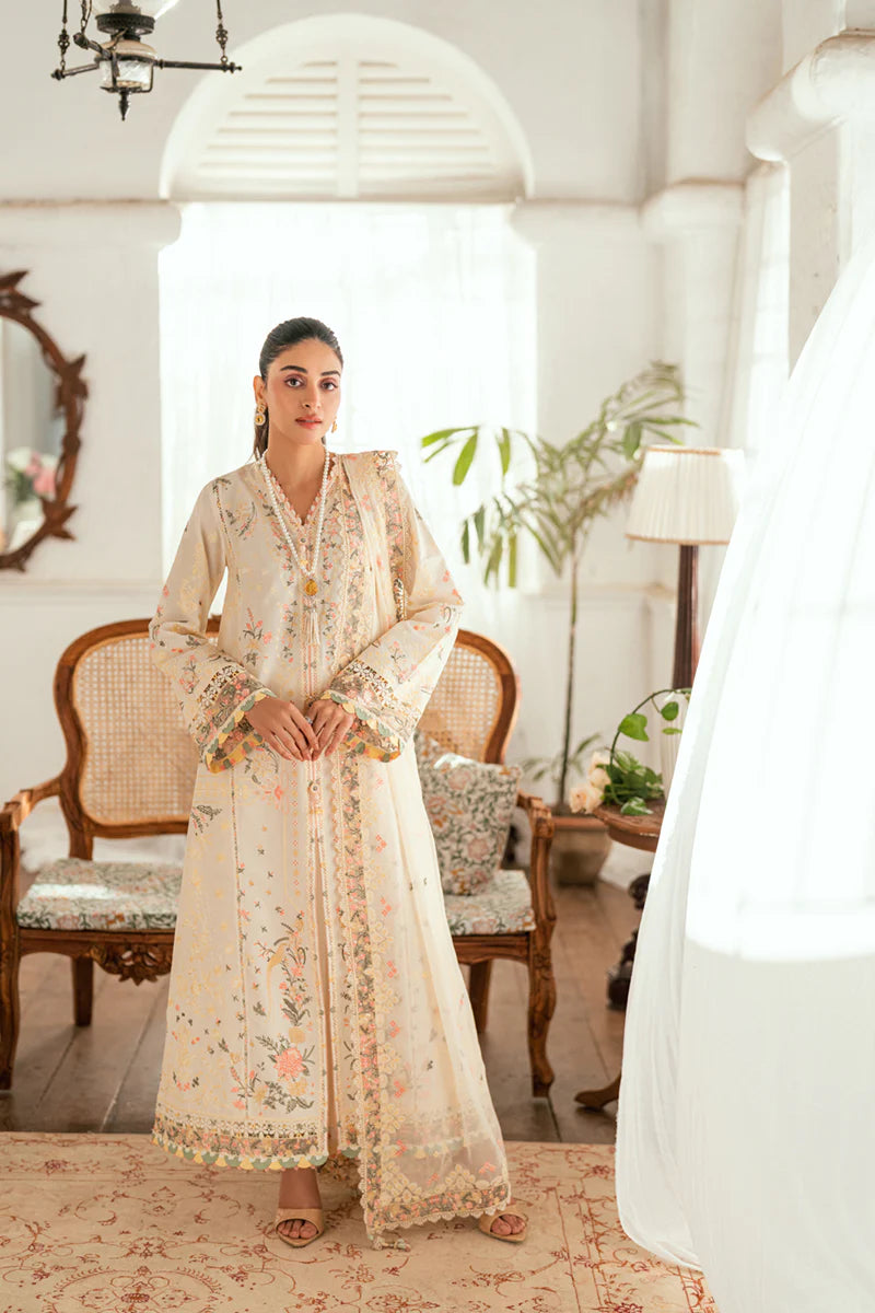 Model wearing ivory Qalamkar SB-01 Rina embroidered suit with pastel floral detailing, perfect for Eid and Pakistani luxury pret in UK.