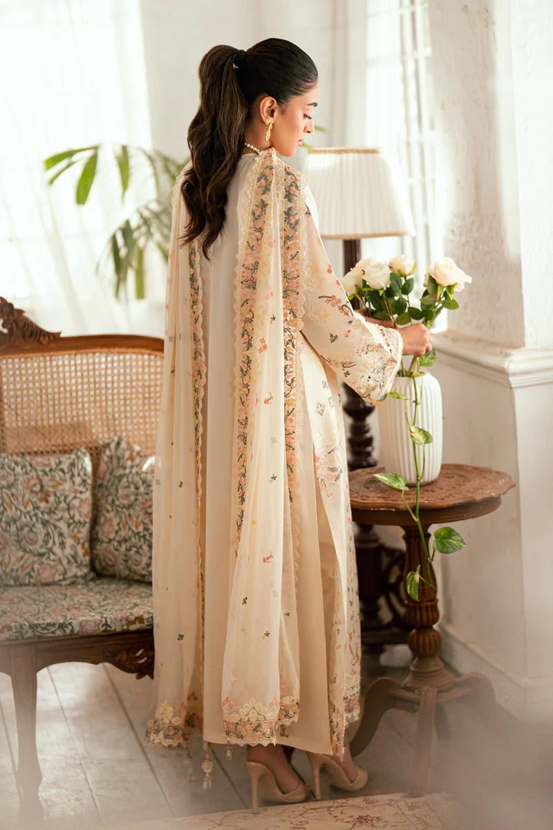 Model wearing ivory Qalamkar SB-01 Rina embroidered suit with pastel floral detailing, perfect for Eid and Pakistani luxury pret in UK.