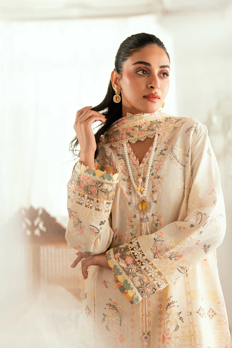 Model wearing ivory Qalamkar SB-01 Rina embroidered suit with pastel floral detailing, perfect for Eid and Pakistani luxury pret in UK.