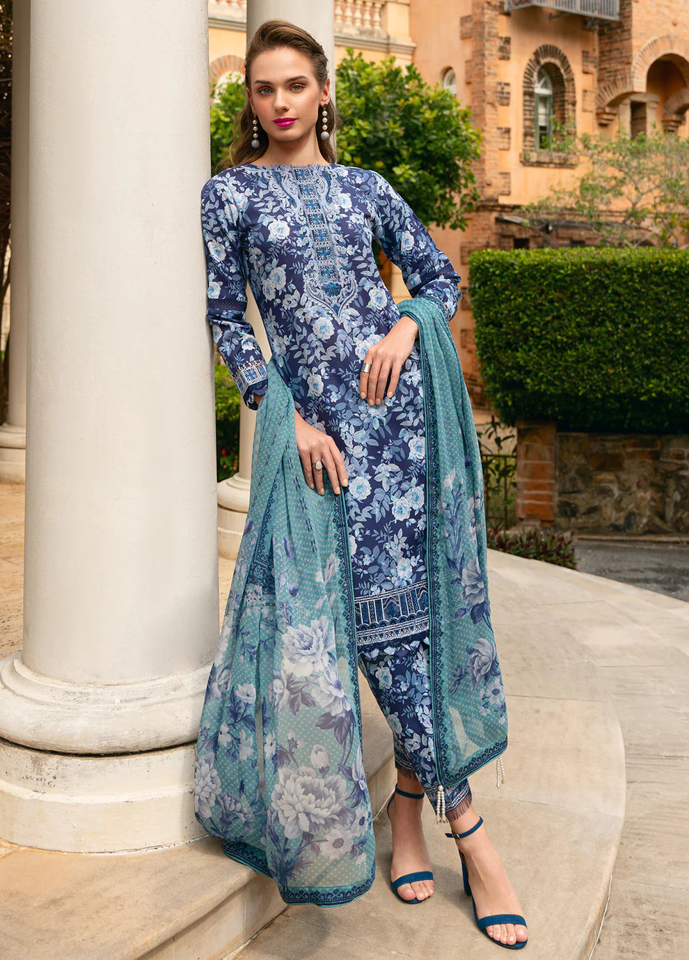 Model in Gulaal OLVERA, floral Pakistani attire, UK fashion must - have.