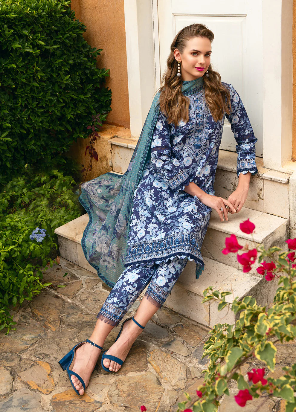 Model in Gulaal OLVERA, floral Pakistani attire, UK fashion must - have.