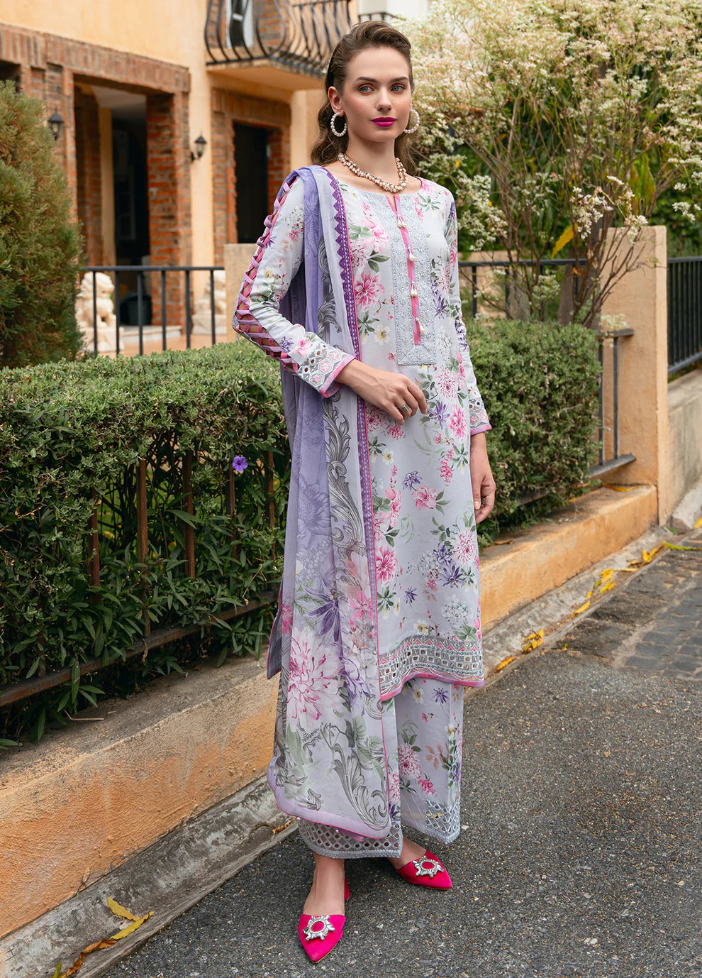 Model in Gulaal VIOLETTE, soft floral print Pakistani suit, UK collection.