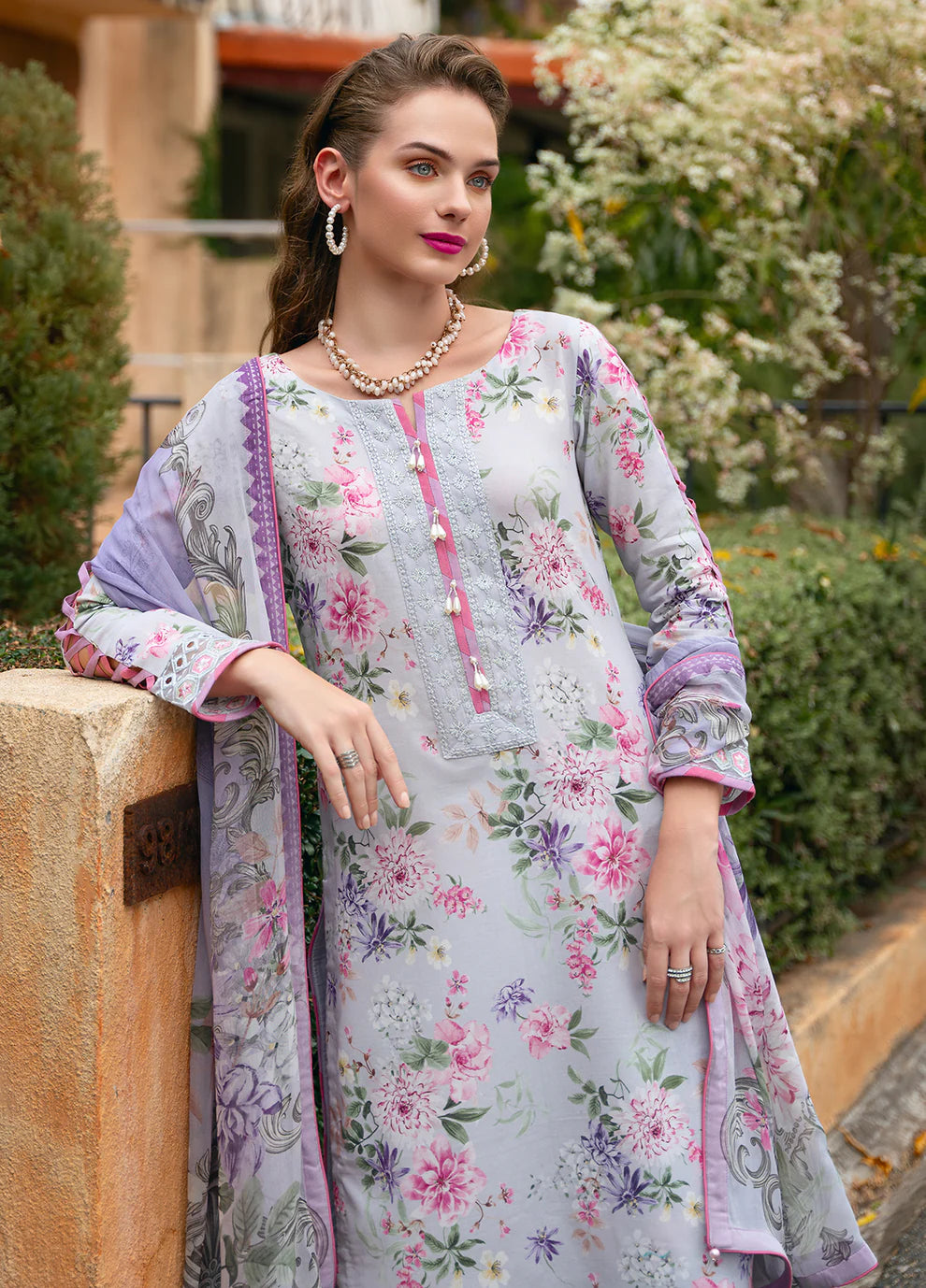 Model in Gulaal VIOLETTE, soft floral print Pakistani suit, UK collection.