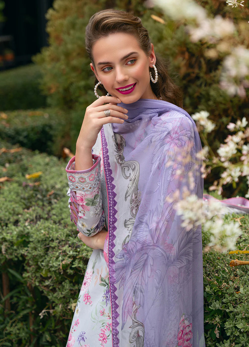 Model in Gulaal VIOLETTE, soft floral print Pakistani suit, UK collection.