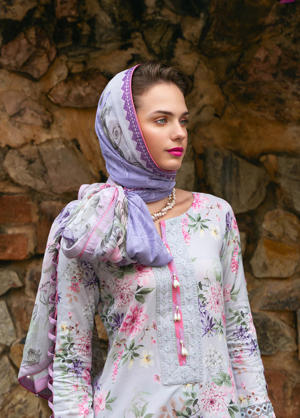 Model in Gulaal VIOLETTE, soft floral print Pakistani suit, UK collection.