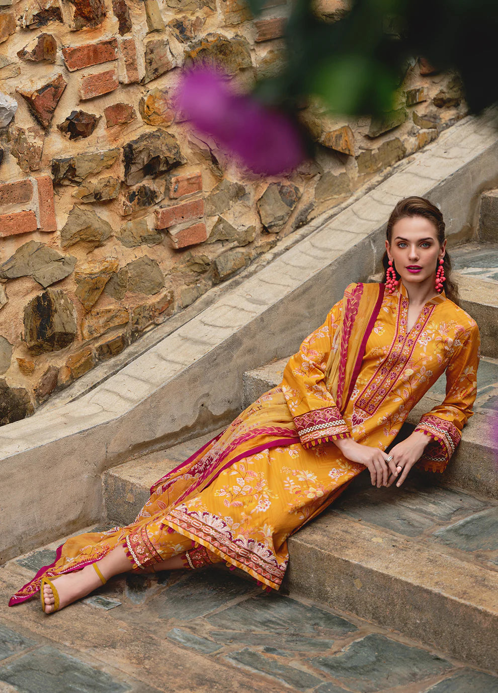 Model in Gulaal FLORENCE, vibrant Pakistani outfit, a UK fashion highlight.