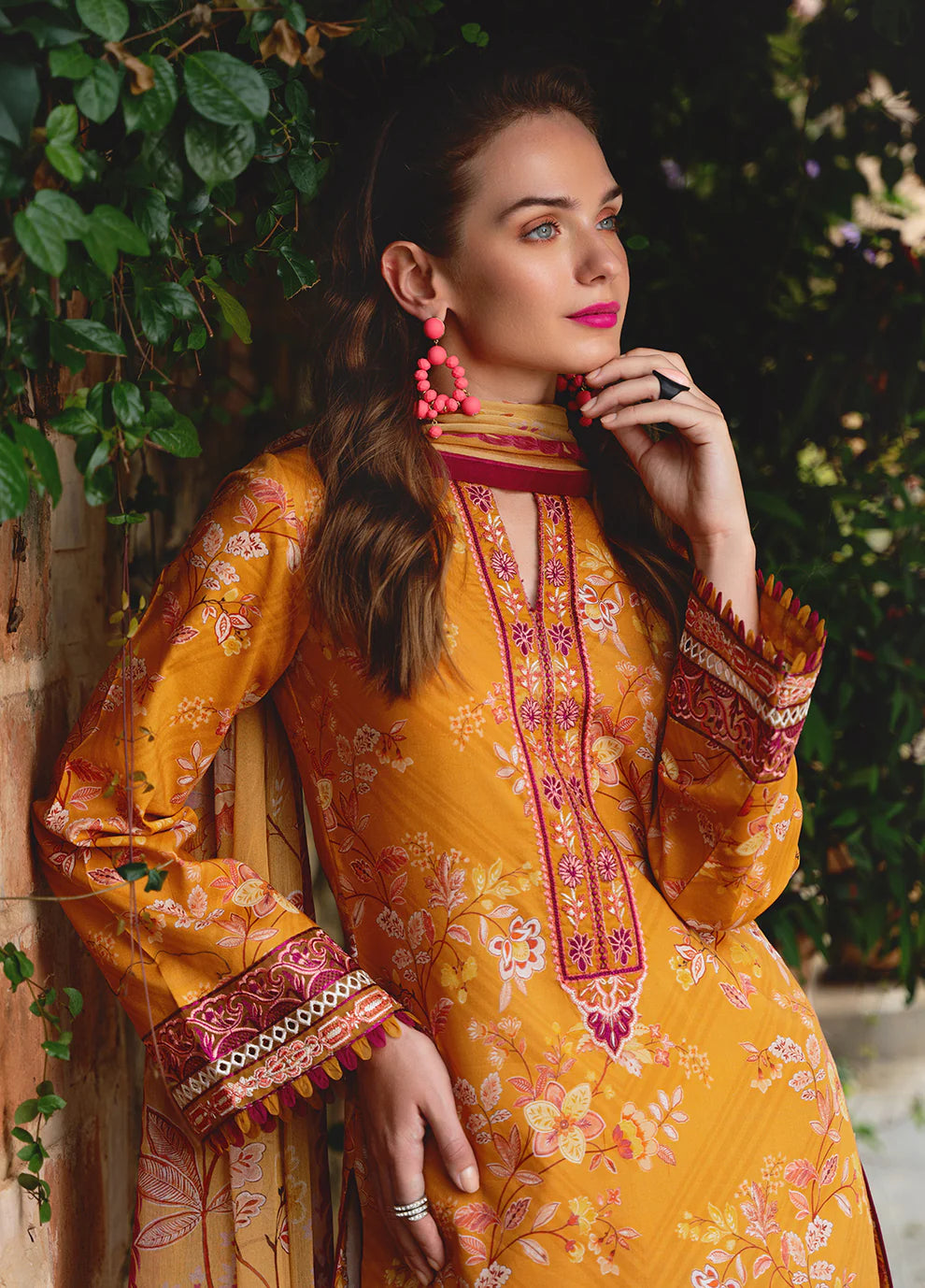 Model in Gulaal FLORENCE, vibrant Pakistani outfit, a UK fashion highlight.