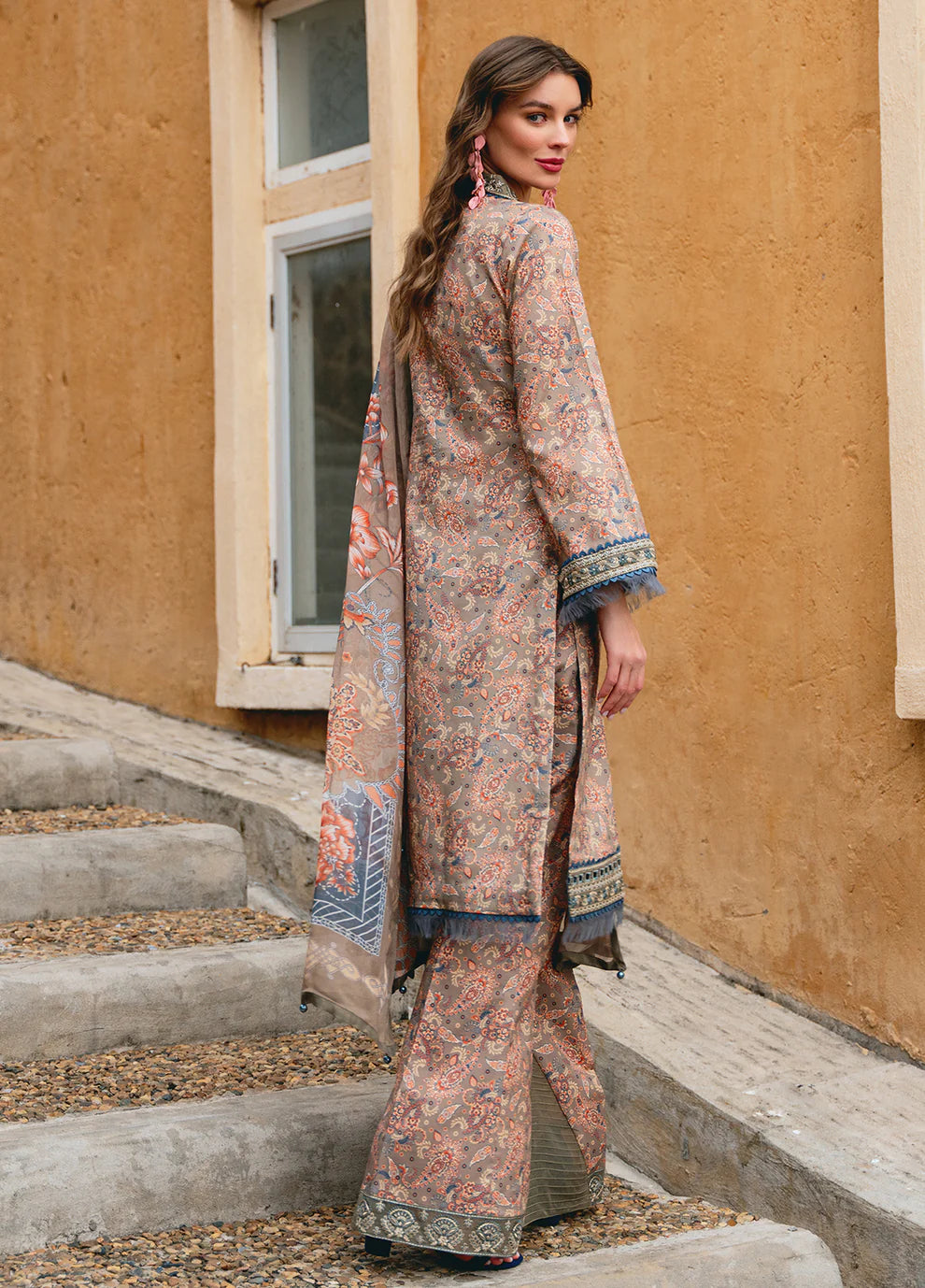 Model in Gulaal AVILA, elegant UK Pakistani outfit, floral design.