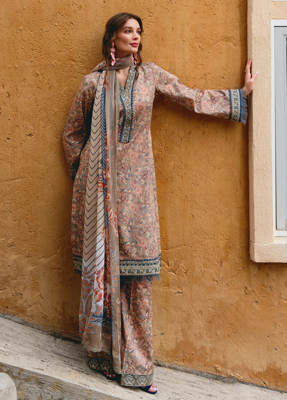 Model in Gulaal AVILA, elegant UK Pakistani outfit, floral design.