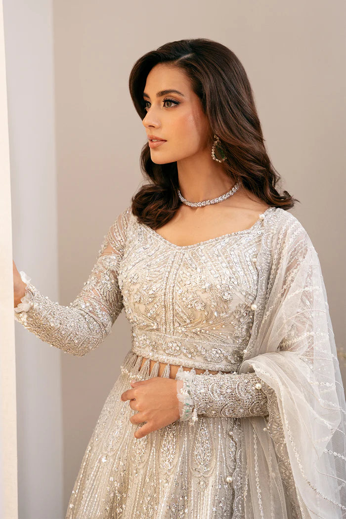 Model wearing LIARA-SRF-D-01 from Saira Rizwan's Festive Unstitched collection in elegant gold. Luxury pret, festive, Pakistani clothes online in UK.