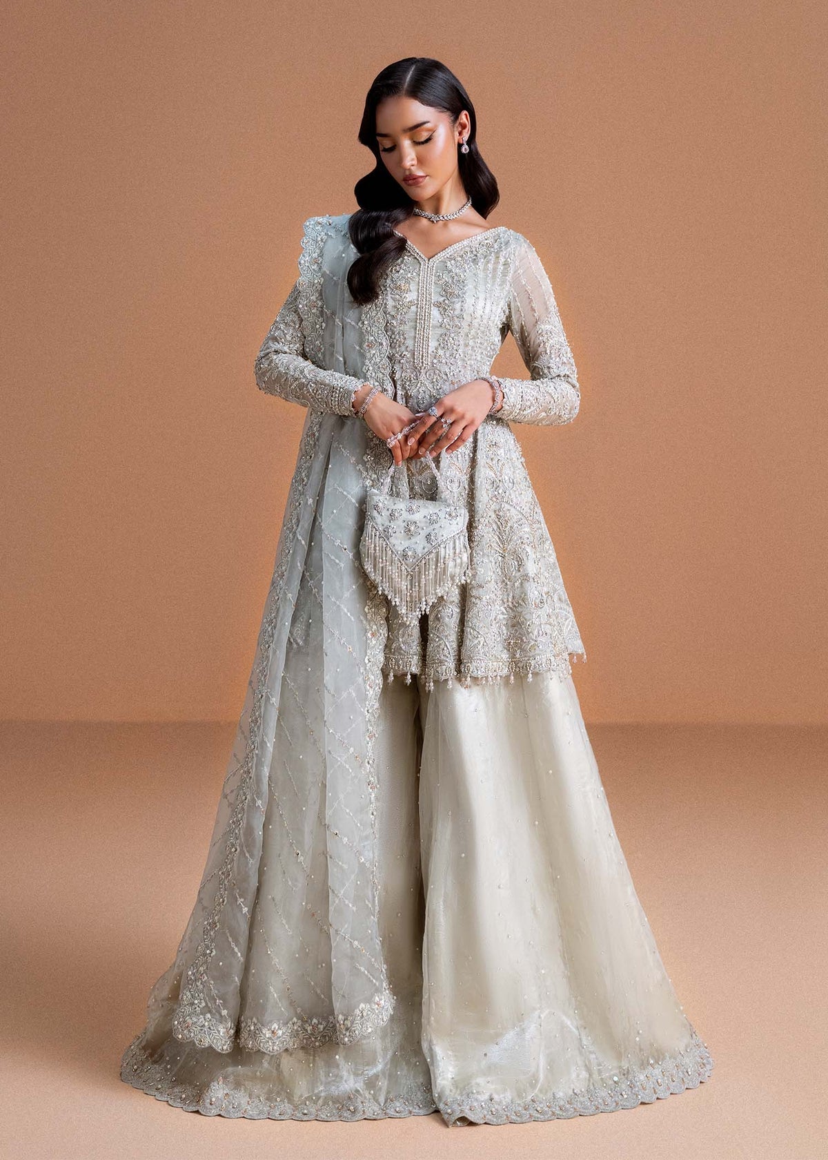 Model wearing silver Mahira outfit from Kanwal Malik, perfect for Pakistani luxury pret and Pakistani clothes online in UK.
