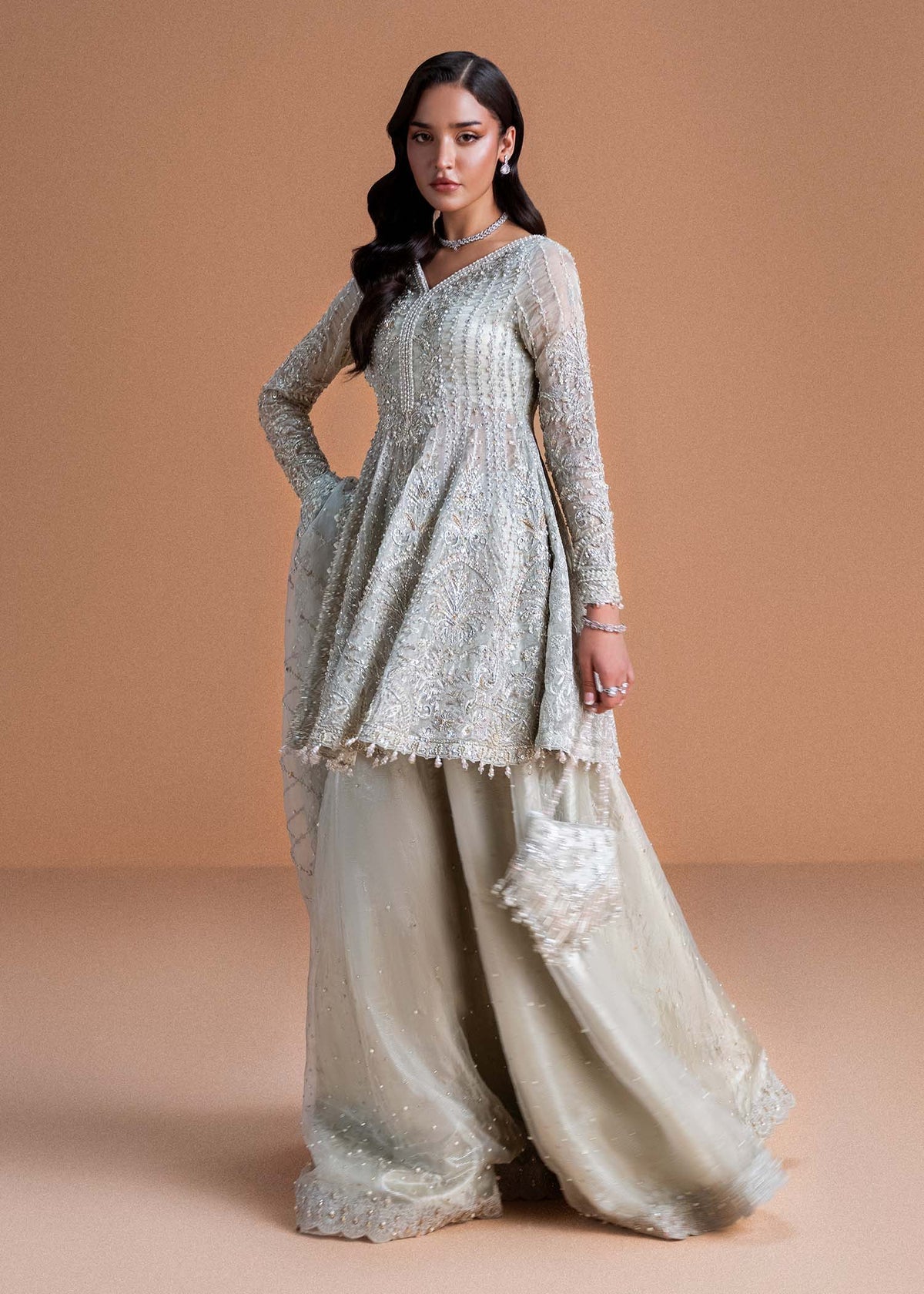 Model wearing silver Mahira outfit from Kanwal Malik, perfect for Pakistani luxury pret and Pakistani clothes online in UK.
