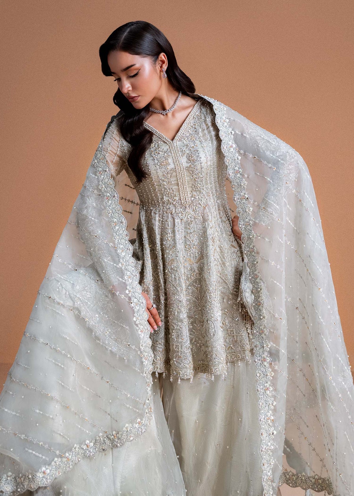 Model wearing silver Mahira outfit from Kanwal Malik, perfect for Pakistani luxury pret and Pakistani clothes online in UK.
