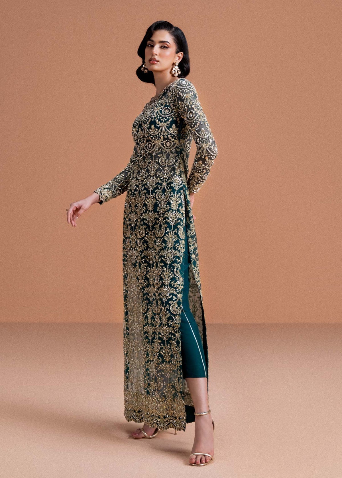 Model wearing deep green and gold Zaira dress from Kanwal Malik, ideal for Pakistani luxury pret and Pakistani clothes online in UK.
