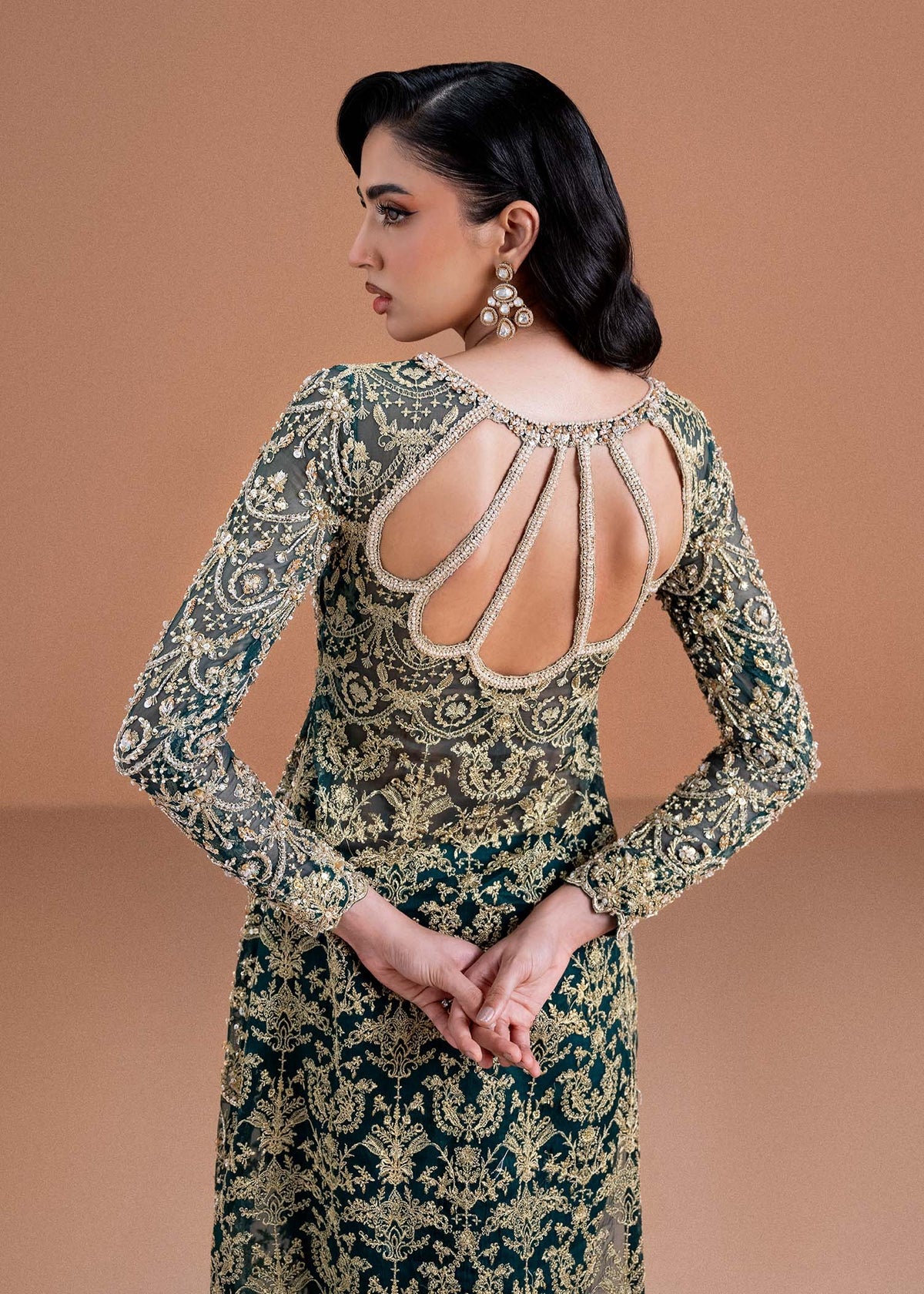 Model wearing deep green and gold Zaira dress from Kanwal Malik, ideal for Pakistani luxury pret and Pakistani clothes online in UK.
