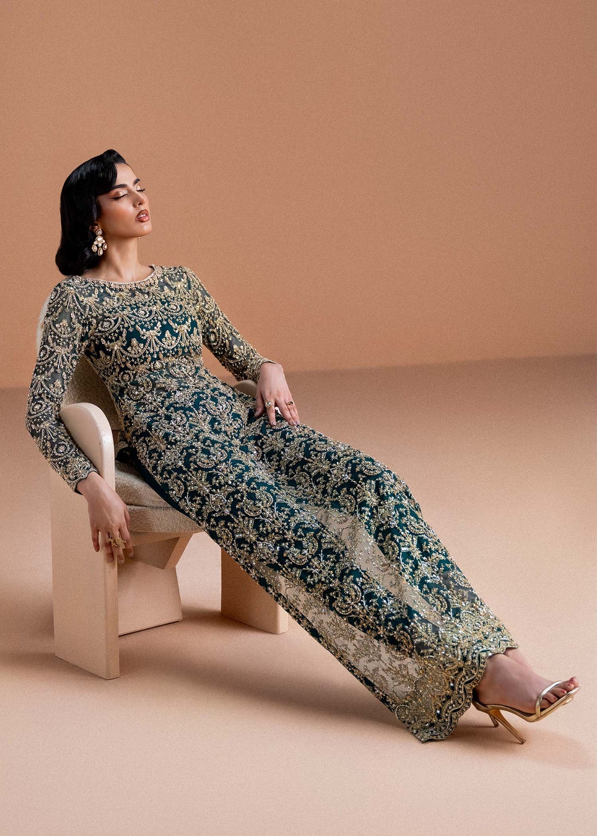 Model wearing deep green and gold Zaira dress from Kanwal Malik, ideal for Pakistani luxury pret and Pakistani clothes online in UK.
