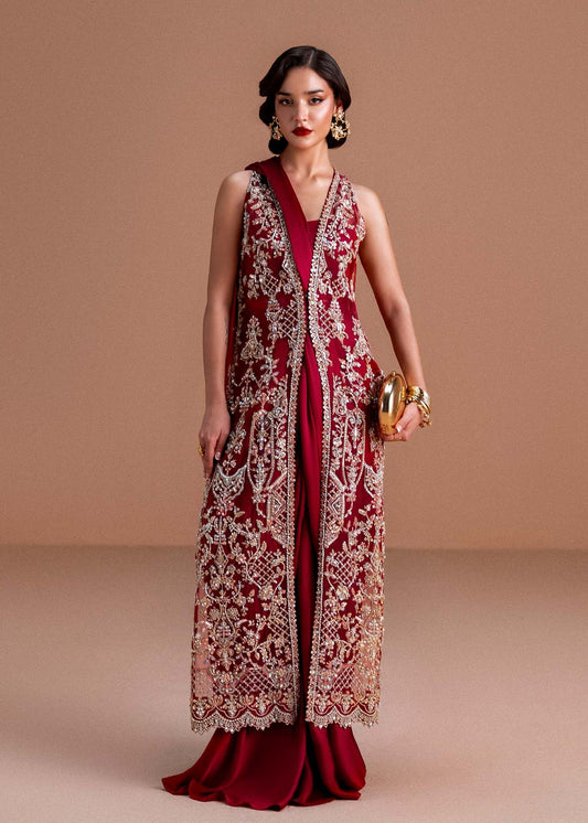 Model wearing deep maroon Naura outfit from Kanwal Malik, featuring intricate embroidery for Pakistani luxury pret and clothes online in UK.