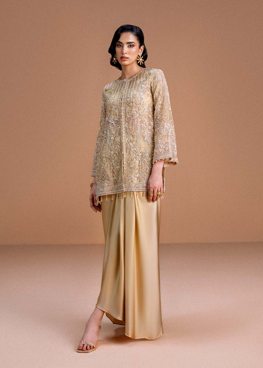 Model wearing gold Aurelia outfit from Kanwal Malik, perfect for Pakistani luxury pret and Pakistani clothes online in UK.
