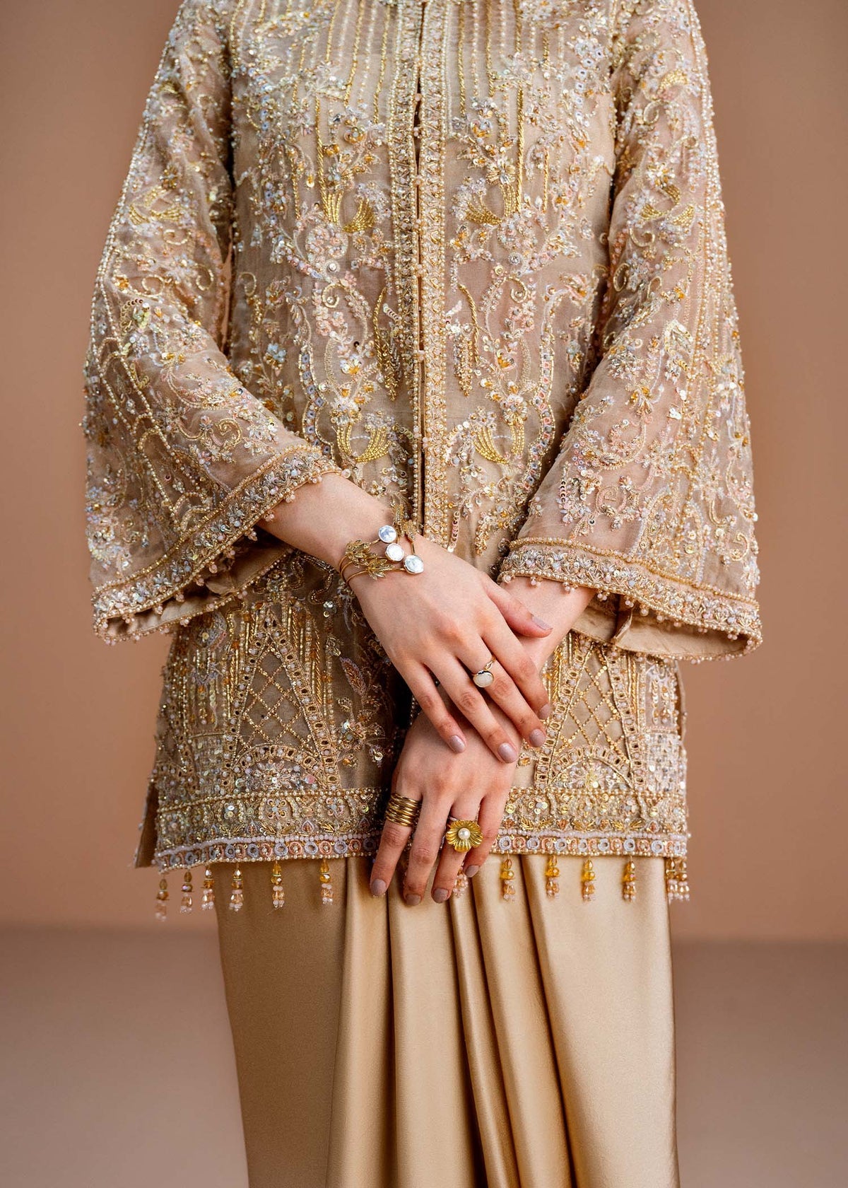 Model wearing gold Aurelia outfit from Kanwal Malik, perfect for Pakistani luxury pret and Pakistani clothes online in UK.
