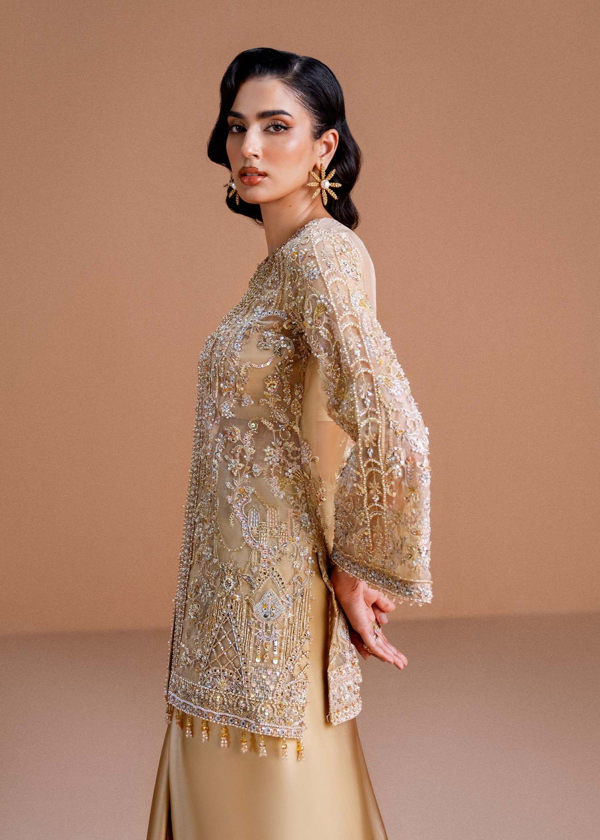 Model wearing gold Aurelia outfit from Kanwal Malik, perfect for Pakistani luxury pret and Pakistani clothes online in UK.
