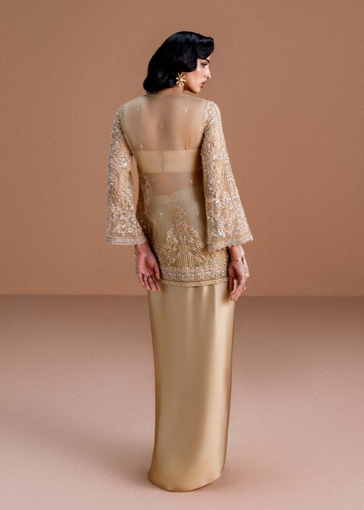 Model wearing gold Aurelia outfit from Kanwal Malik, perfect for Pakistani luxury pret and Pakistani clothes online in UK.
