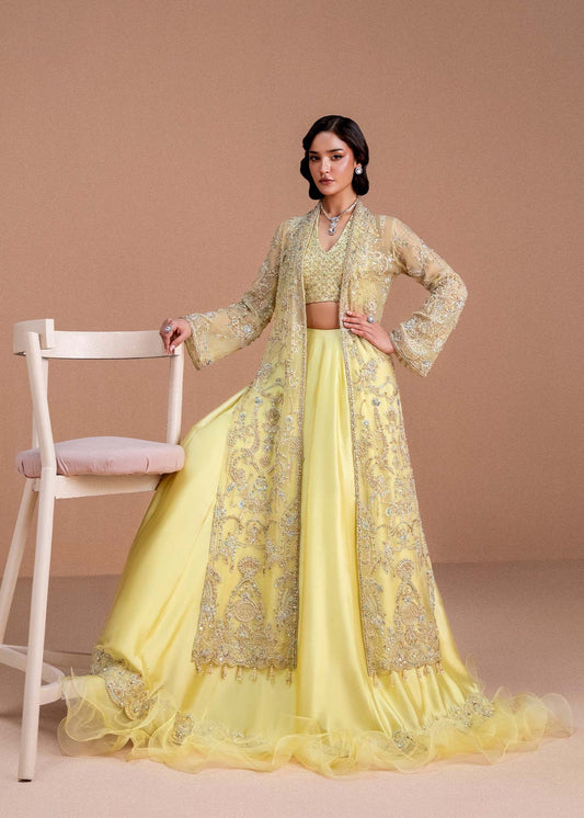 Model wearing lemon yellow Meira outfit from Kanwal Malik, featuring intricate embellishments for Pakistani luxury pret and clothes online in UK.
