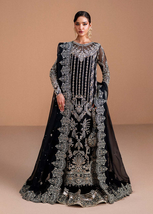 Model wearing black Rayen outfit from Kanwal Malik, showcasing intricate embroidery for Pakistani luxury pret and clothes online in UK.
