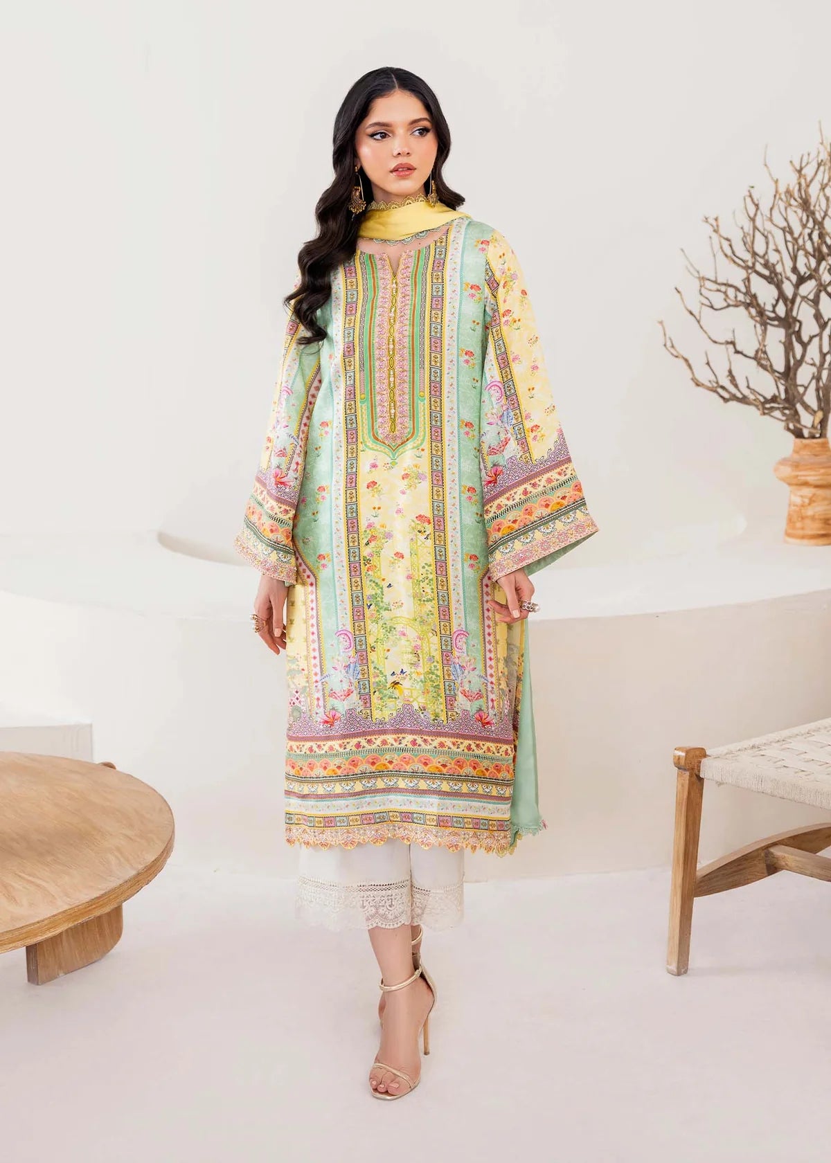 Model wearing pastel yellow and mint green Mira from Kanwal Malik Rosalia Silk Eid Collection '25, Pakistani luxury pret online in UK.