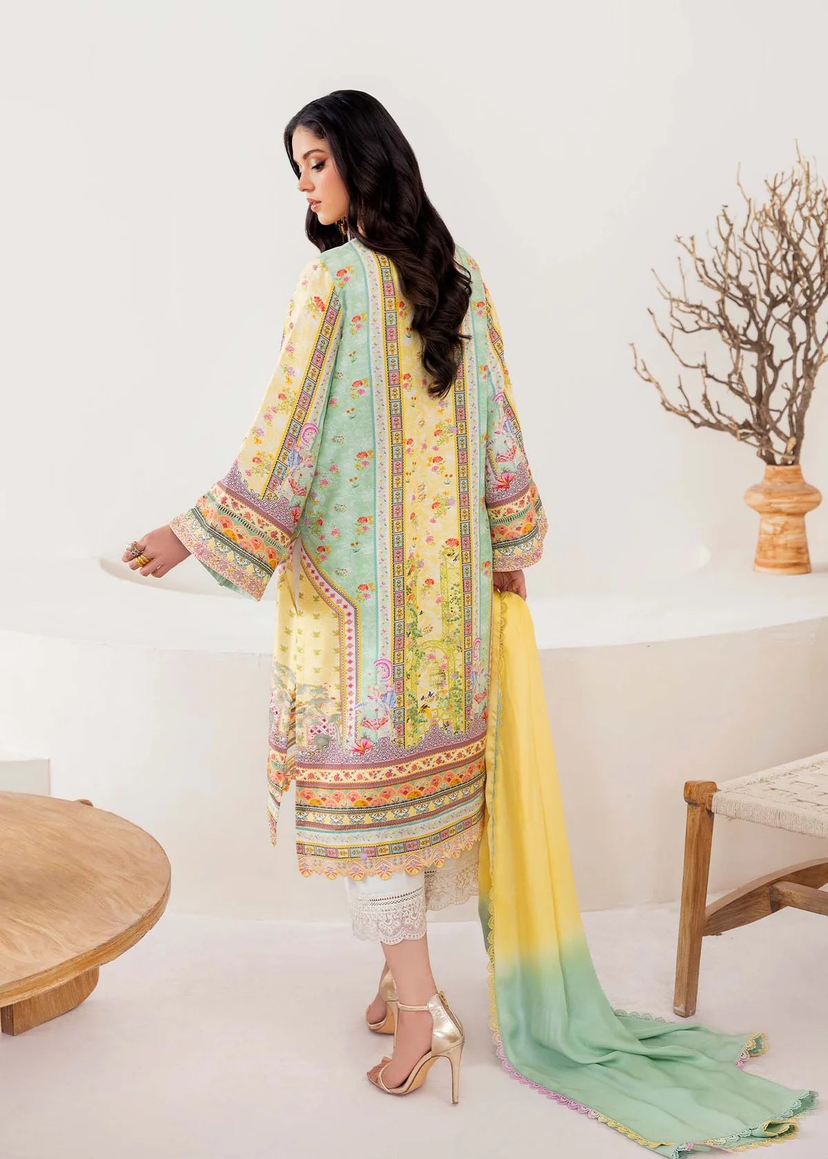 Model wearing pastel yellow and mint green Mira from Kanwal Malik Rosalia Silk Eid Collection '25, Pakistani luxury pret online in UK.
