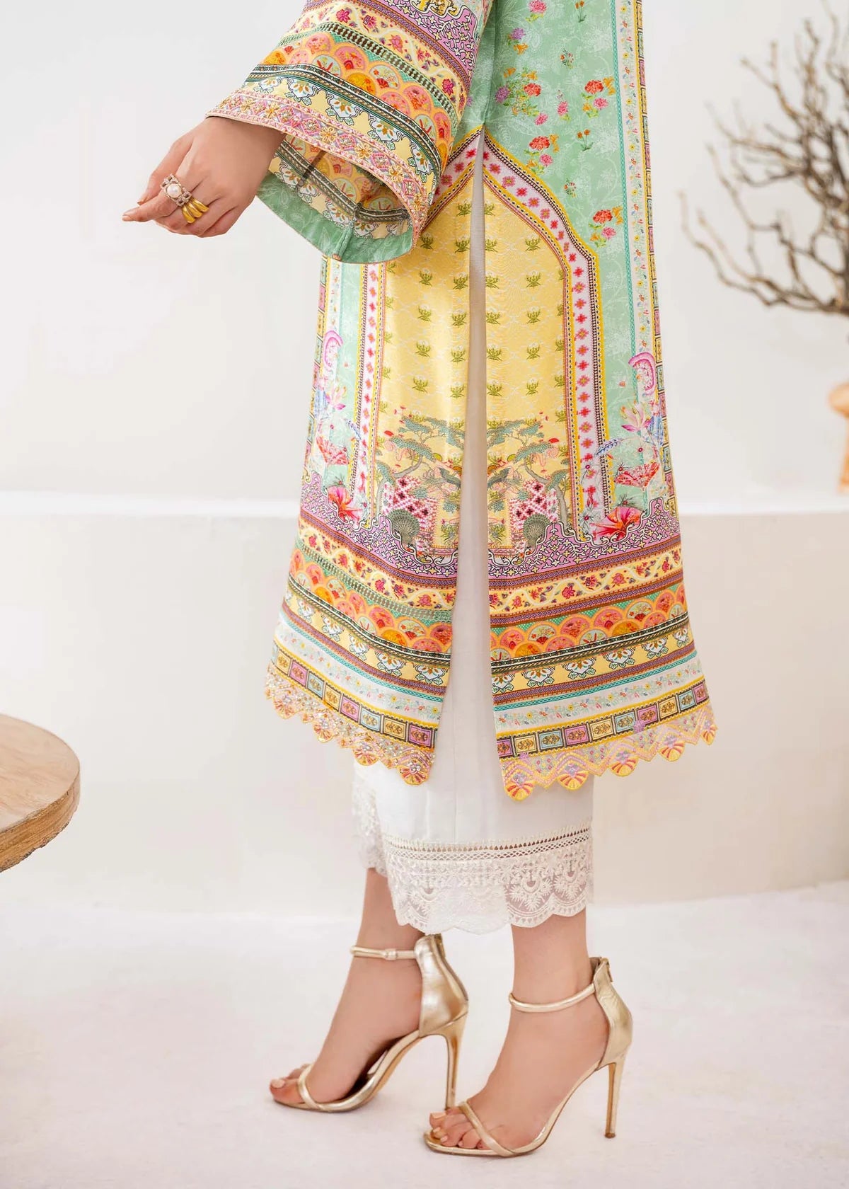 Model wearing pastel yellow and mint green Mira from Kanwal Malik Rosalia Silk Eid Collection '25, Pakistani luxury pret online in UK.