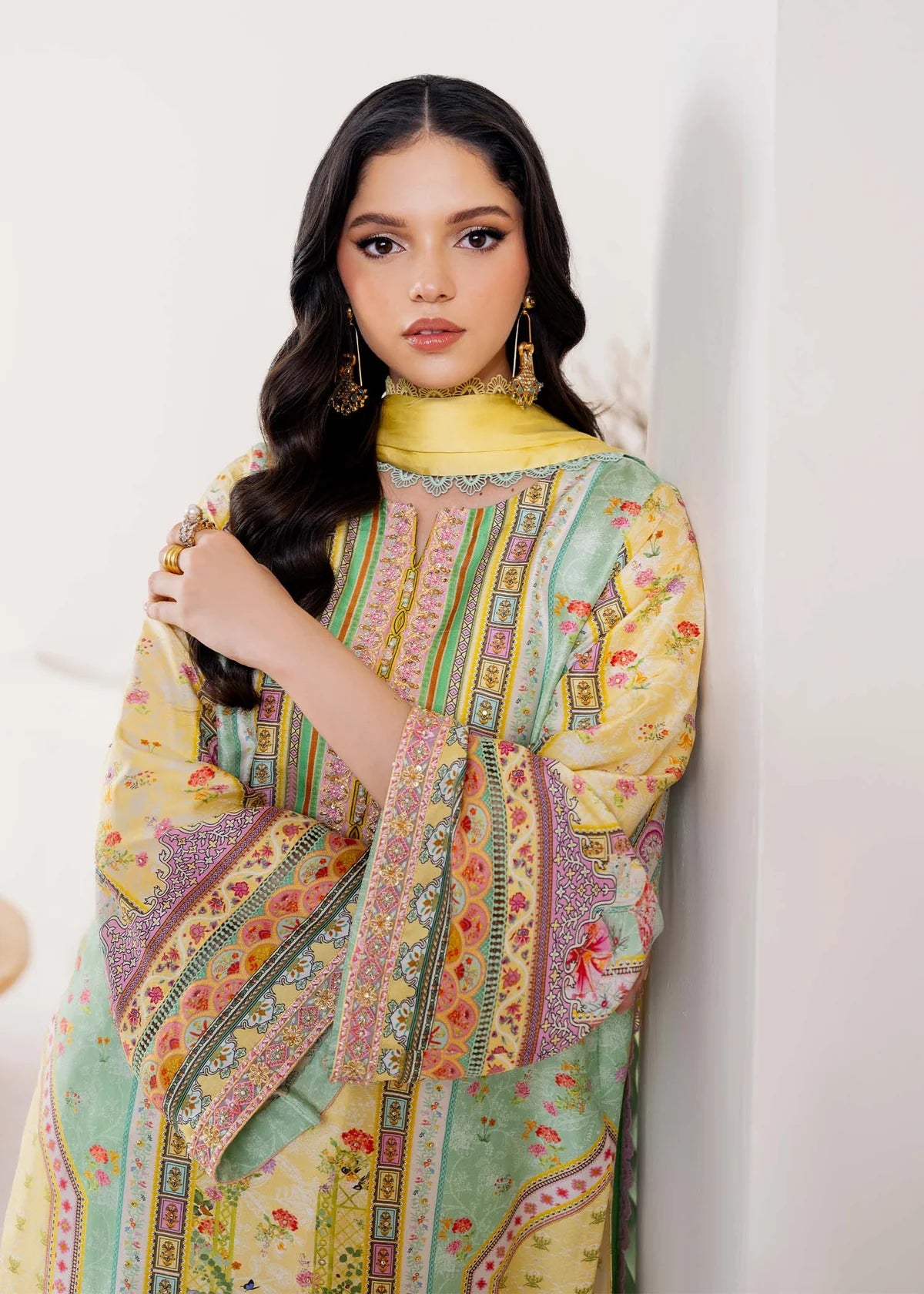 Model wearing pastel yellow and mint green Mira from Kanwal Malik Rosalia Silk Eid Collection '25, Pakistani luxury pret online in UK.