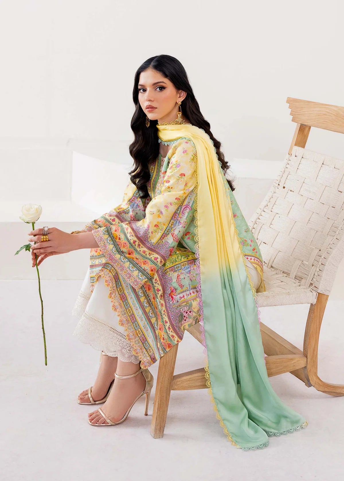 Model wearing pastel yellow and mint green Mira from Kanwal Malik Rosalia Silk Eid Collection '25, Pakistani luxury pret online in UK.