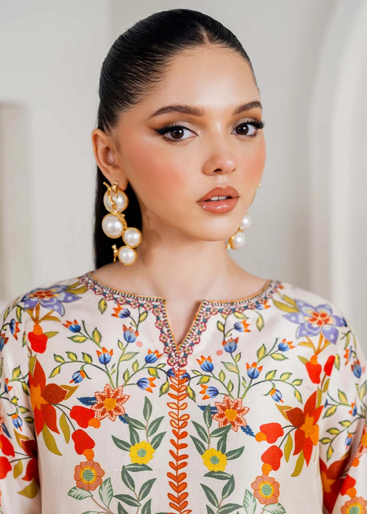 Model wearing ivory multicolour floral Kanwal Malik Celia from Rosalia Silk Eid Collection '25, Pakistani luxury pret available in UK online.
