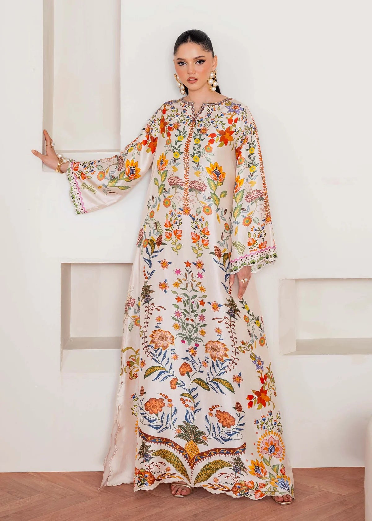Model wearing ivory multicolour floral Kanwal Malik Celia from Rosalia Silk Eid Collection '25, Pakistani luxury pret available in UK online.