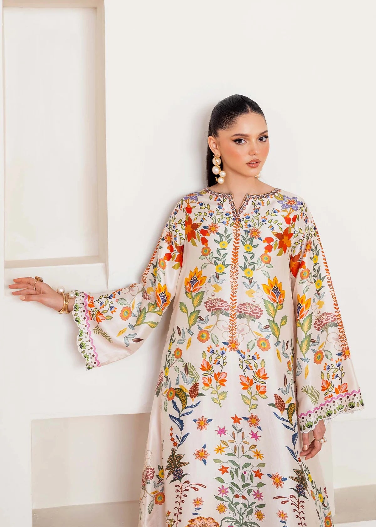 Model wearing ivory multicolour floral Kanwal Malik Celia from Rosalia Silk Eid Collection '25, Pakistani luxury pret available in UK online.