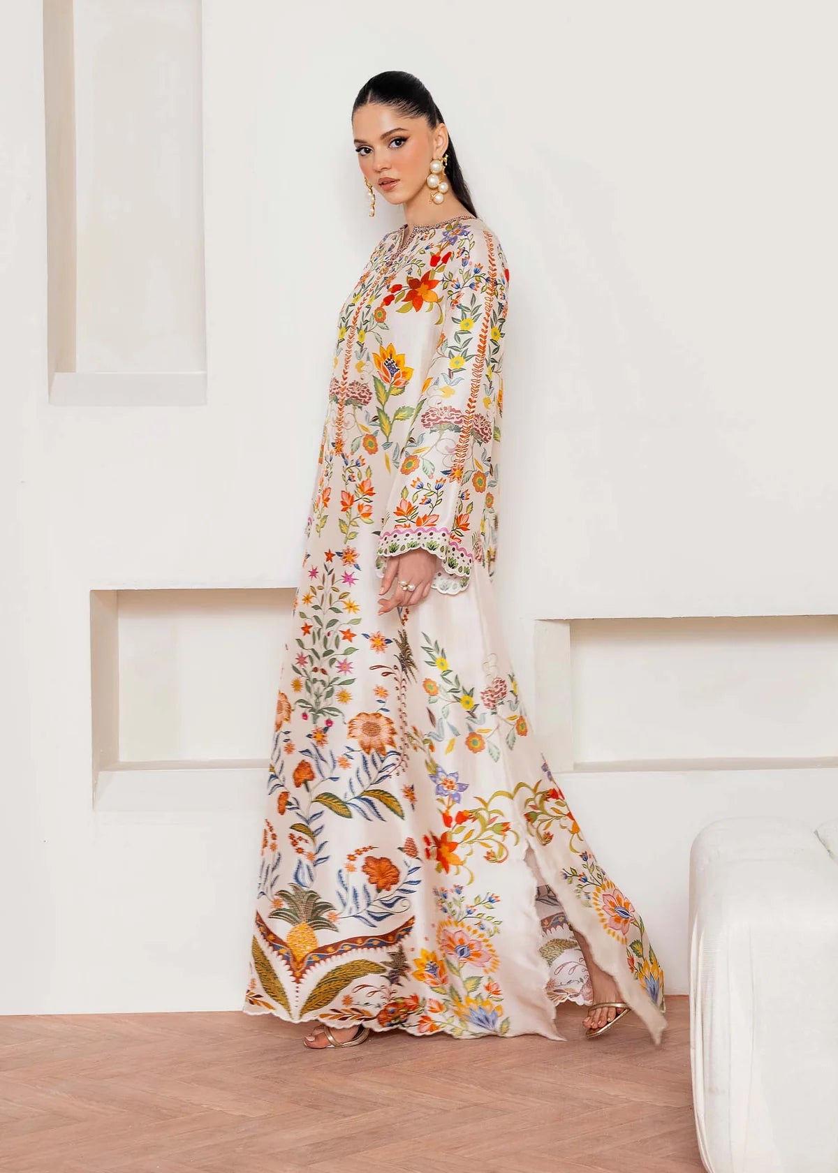 Model wearing ivory multicolour floral Kanwal Malik Celia from Rosalia Silk Eid Collection '25, Pakistani luxury pret available in UK online.