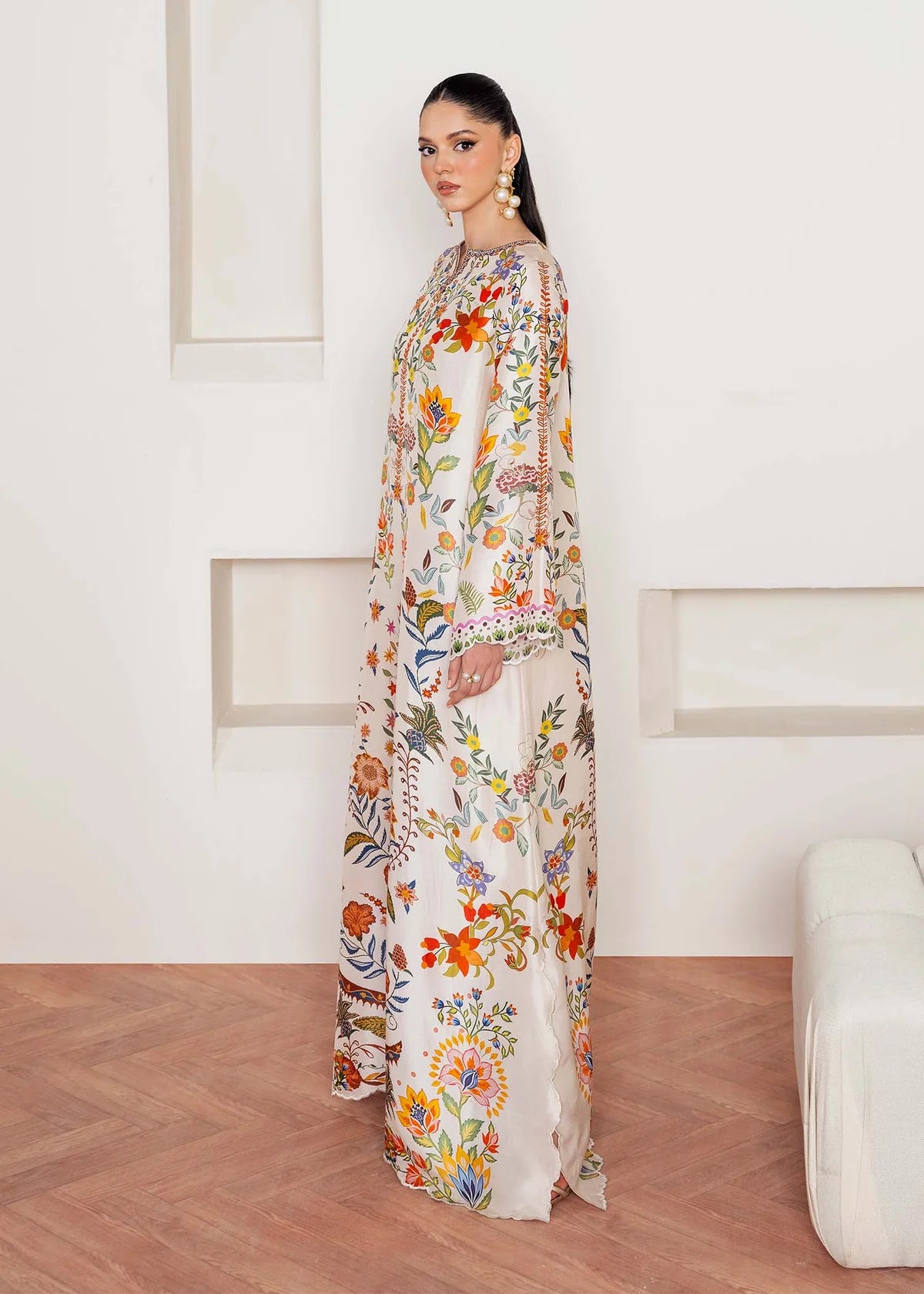 Model wearing ivory multicolour floral Kanwal Malik Celia from Rosalia Silk Eid Collection '25, Pakistani luxury pret available in UK online.