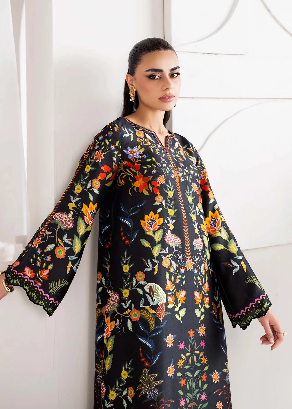 Model wearing black multicolour floral Kanwal Malik Sovana from Rosalia Silk Eid Collection '25, Pakistani luxury pret online in UK.
