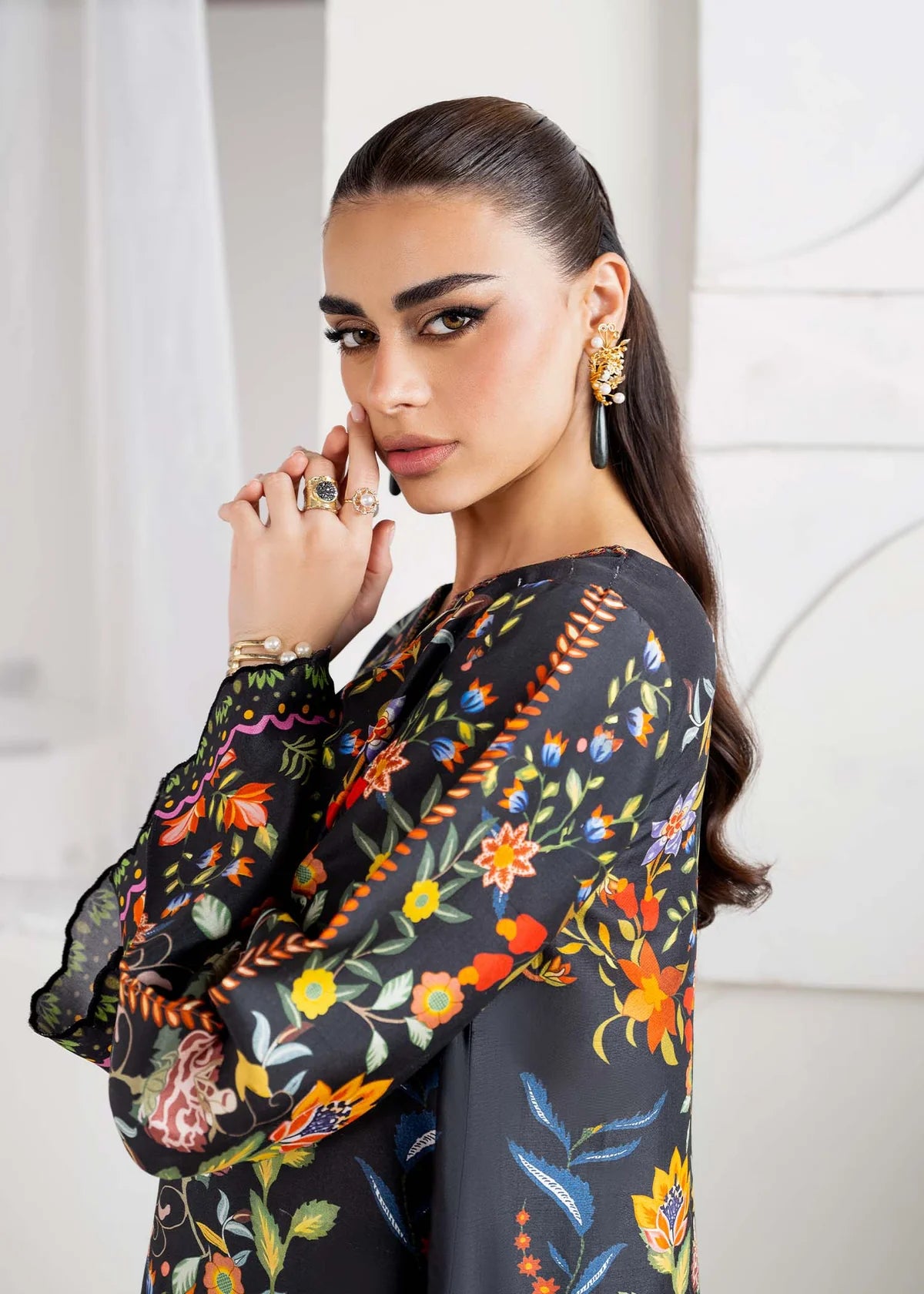 Model wearing black multicolour floral Kanwal Malik Sovana from Rosalia Silk Eid Collection '25, Pakistani luxury pret online in UK.