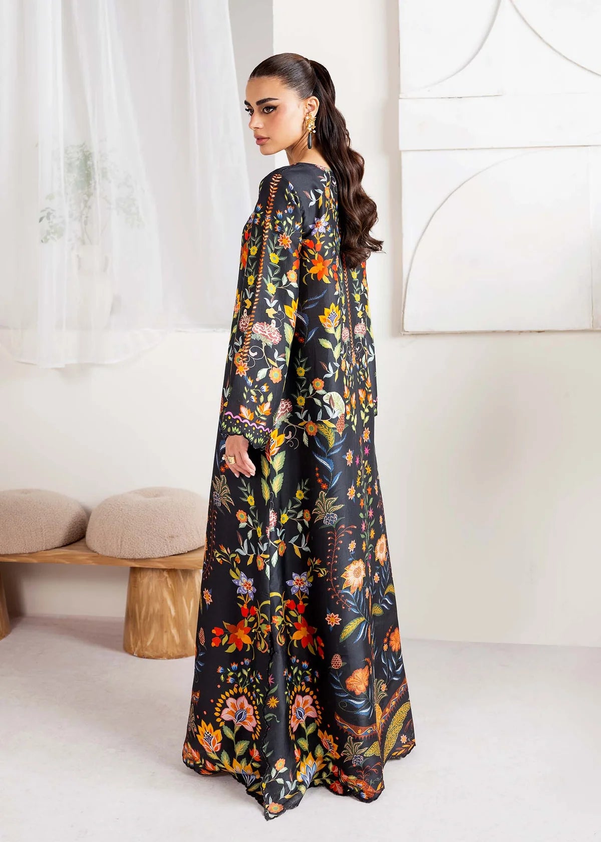 Model wearing black multicolour floral Kanwal Malik Sovana from Rosalia Silk Eid Collection '25, Pakistani luxury pret online in UK.