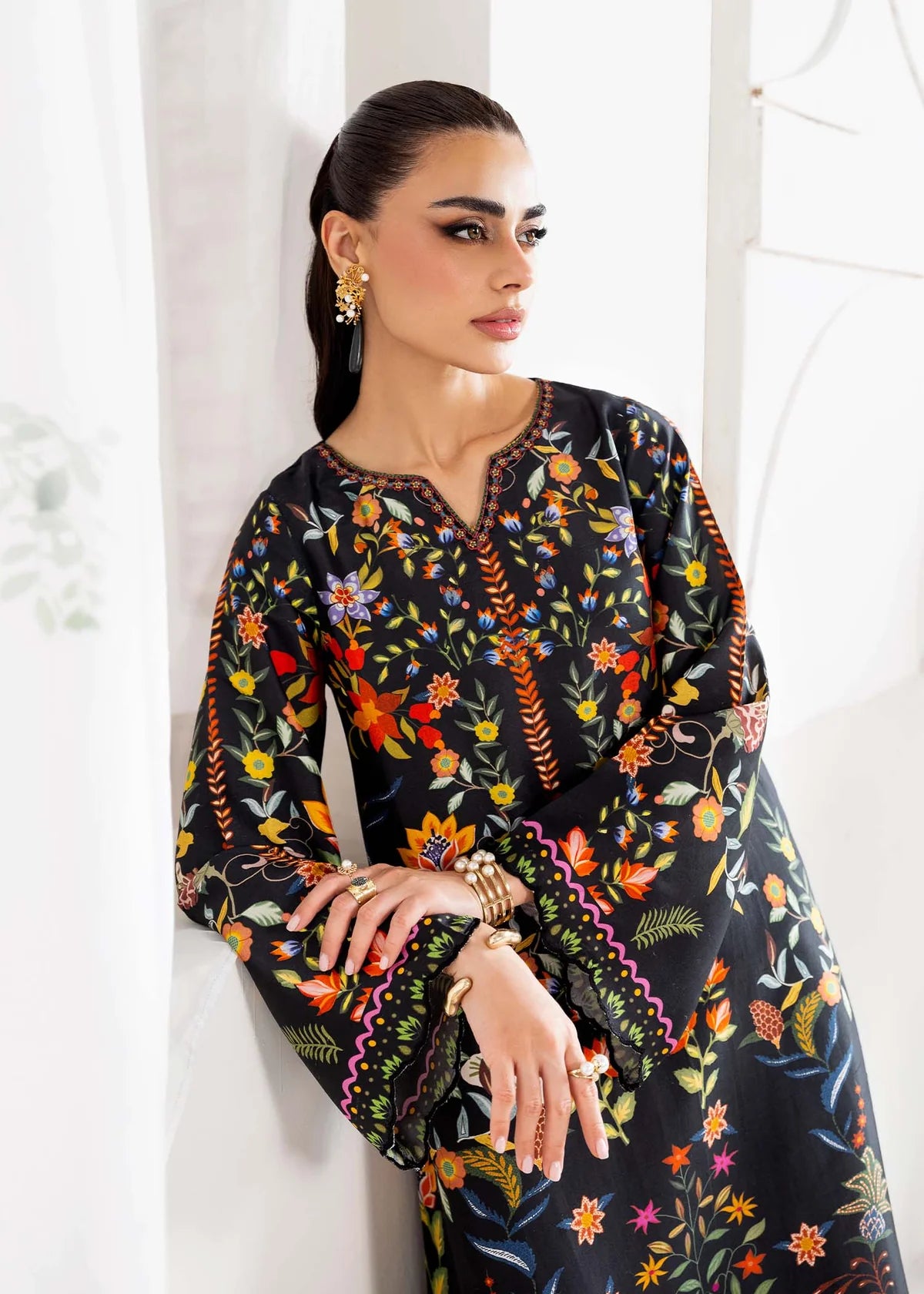 Model wearing black multicolour floral Kanwal Malik Sovana from Rosalia Silk Eid Collection '25, Pakistani luxury pret online in UK.