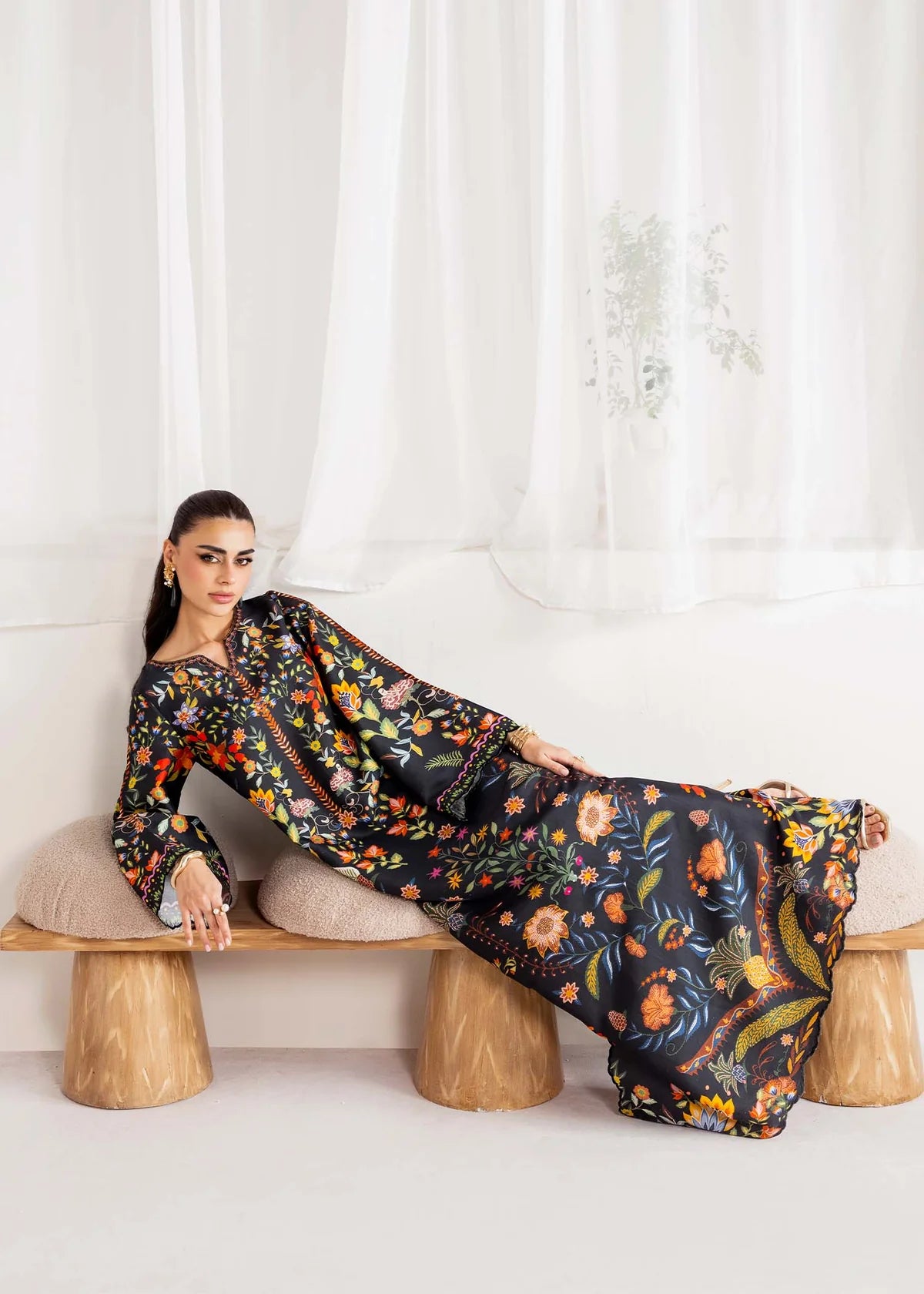 Model wearing black multicolour floral Kanwal Malik Sovana from Rosalia Silk Eid Collection '25, Pakistani luxury pret online in UK.