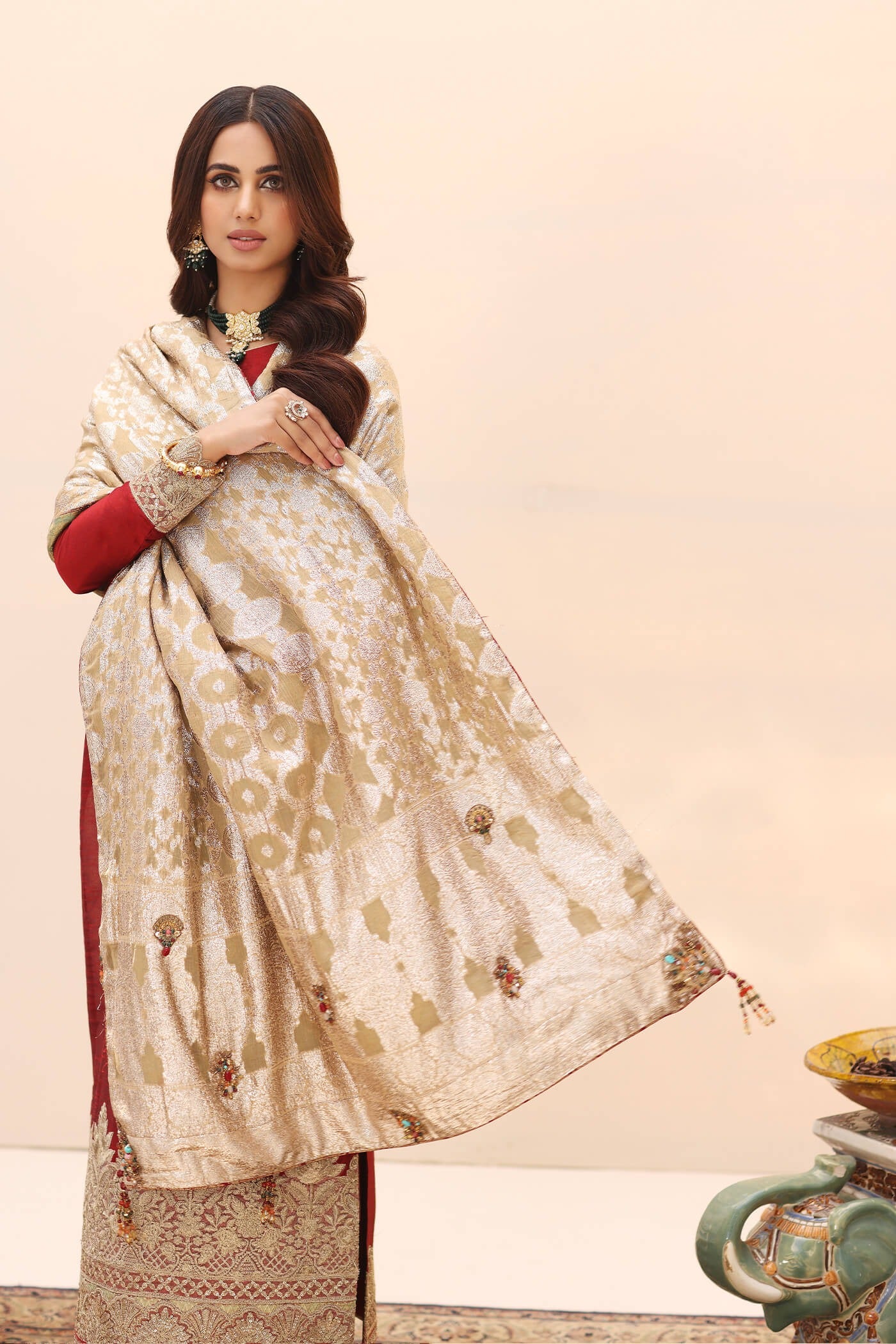 Model wearing a red ENCHANTED AURORA SHAWL dress from Musferah Saad's Ethereal Embrace Shawl Collection '23, highlighting Pakistani clothes online in the UK.